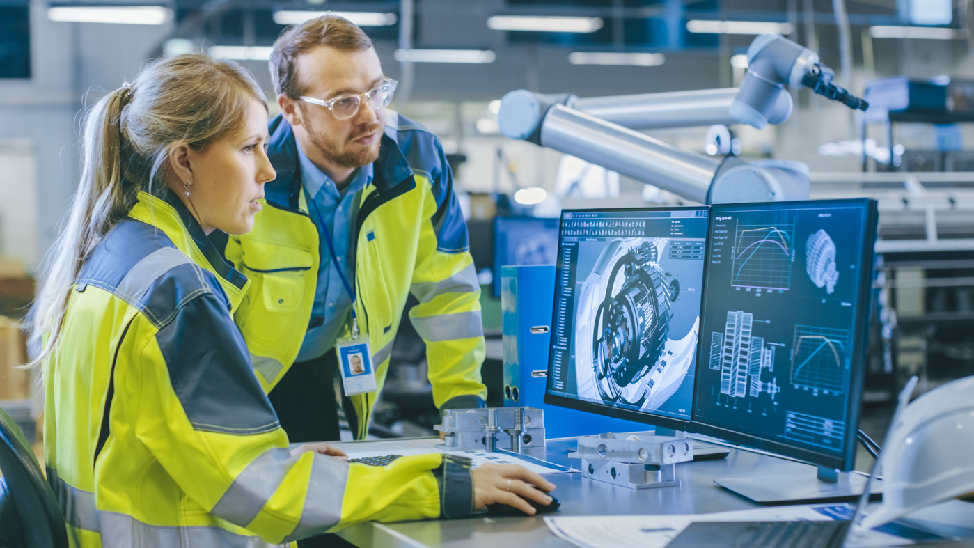 Maschinenbauingenieure FH nehmen Qualitätskontrollen an einem Produkt-Bestandteil vor.